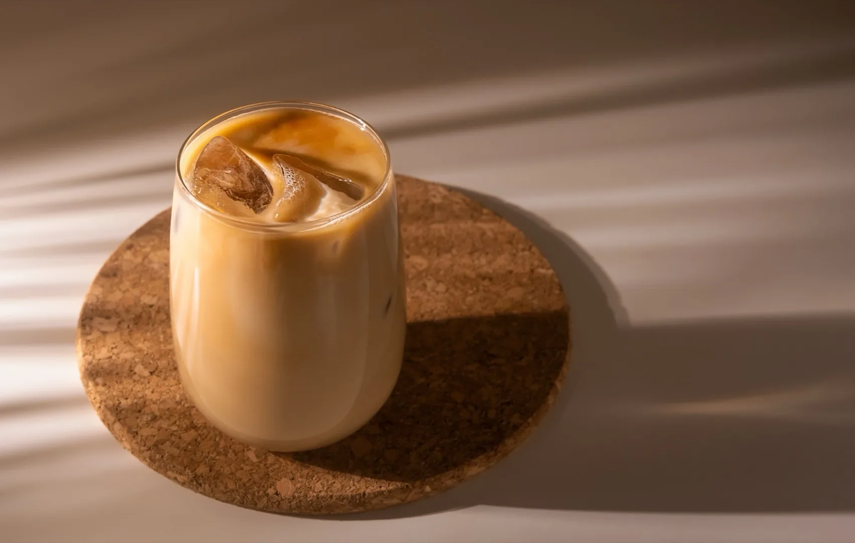 Iced coffee latte with cream in a glass — popular Dubai cafe drink