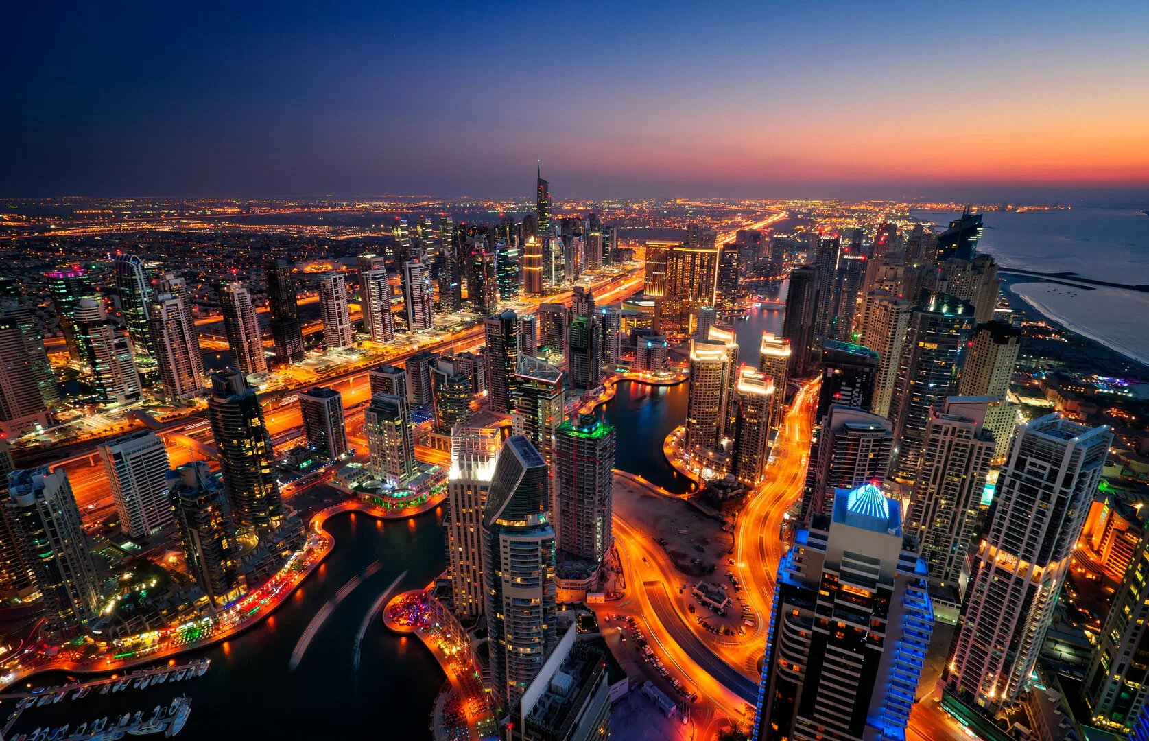 Dubai Marina aerial view at sunset showing waterfront apartments