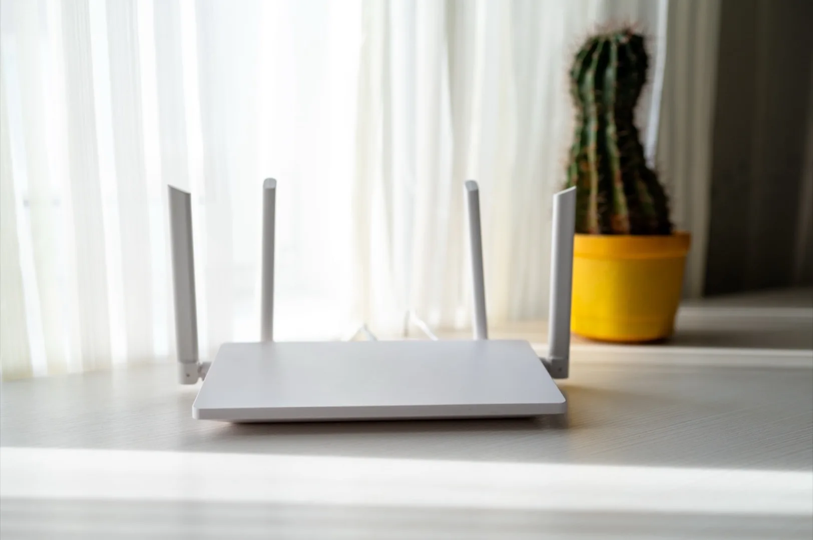 Modern WiFi router on desk for home internet setup in Dubai